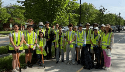 Volunteers wearing safety vests after a Chattahoochee riverside cleanup