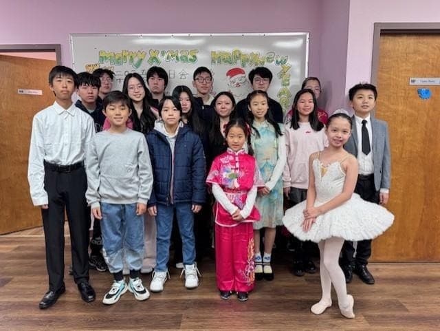 Student performers posing together at Crabapple Town Center