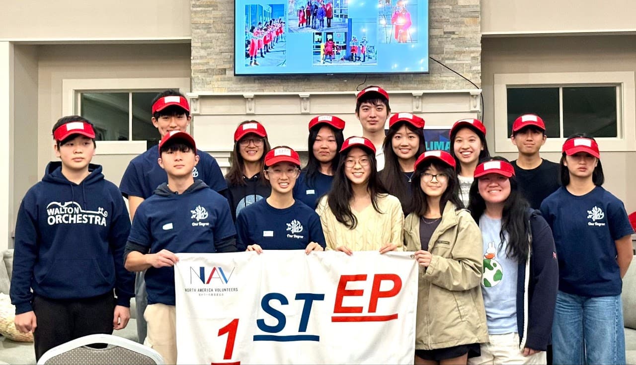 First Step members gathered with the team banner at a graduation celebration