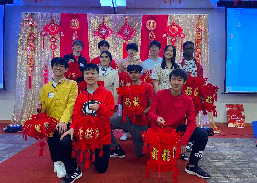 First Step performers in red costumes at a Lunar New Year gala