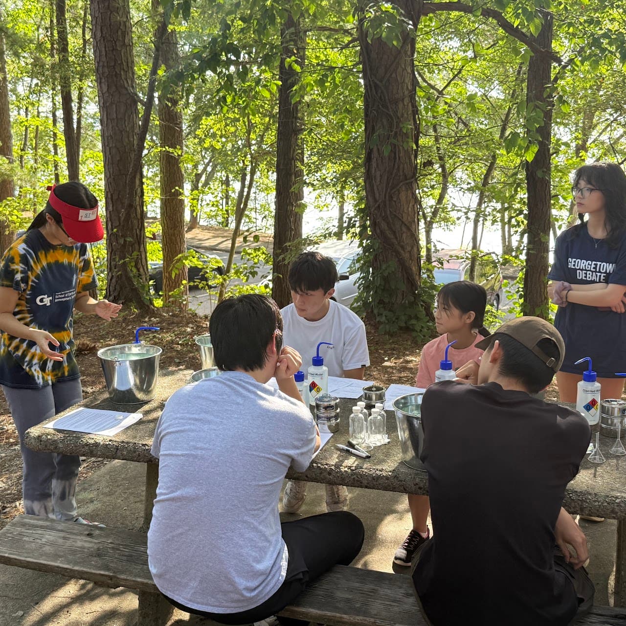 Students preparing water sampling bottles beside the Chattahoochee watershed