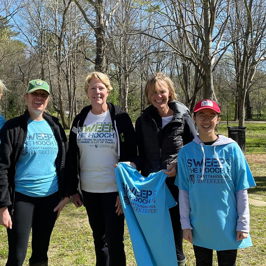 First Step volunteers gathered beside the river for Sweep the Hooch