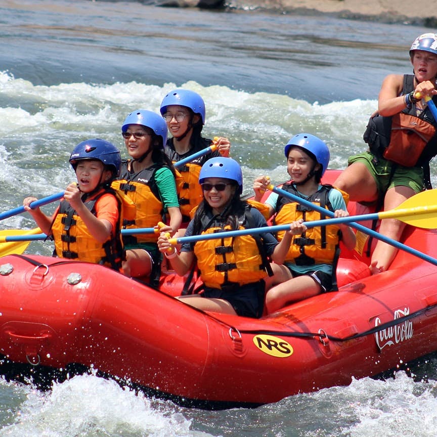 First Step members rafting together during a team trip